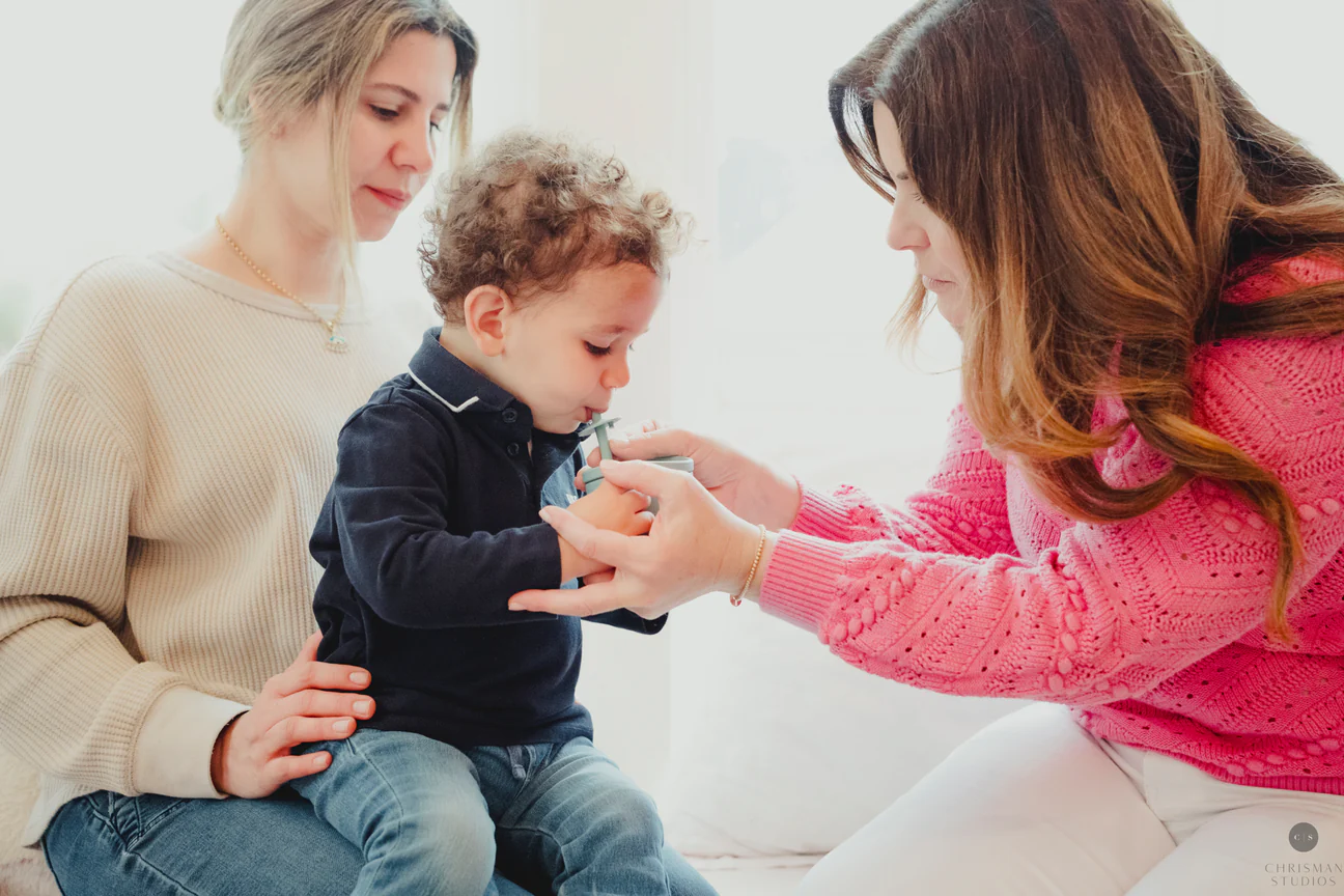 TalkTools therapy session — a clinician working with a child using oral placement tools